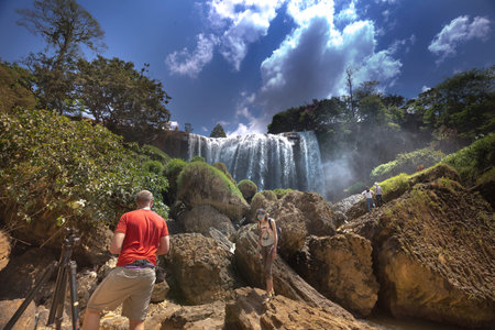 Lam Dong province, Viet Nam - March 25, 2017: Elephant waterfall in sunny day with tourists to visitのeditorial素材