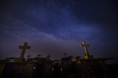 Cemetery at Bao Loc Town, Lam Dong Province, Vietnam - March 25, 2017: Cemetery with many tombs under the twinkle stars sky in nightのeditorial素材