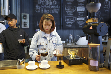 Da Lat town,Vietnam - April 30, 2017 : professional coffee staff doing their work at the "La Viet" cafe in Da Lat town, Vietnamのeditorial素材