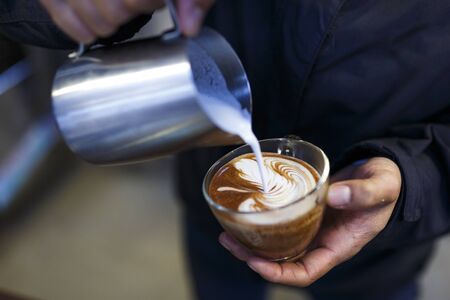 Da Lat town,Vietnam - April 30, 2017 :  Barista making fresh coffee latte. Professional coffee staff doing their work at the "La Viet" cafe in Da Lat town, Vietnamのeditorial素材