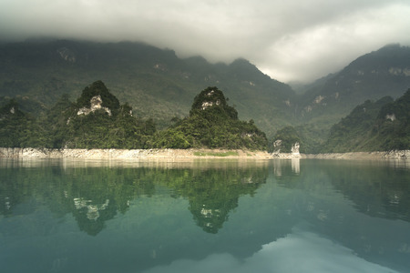 Na Hang lake in Tuyen Quang province, Viet Nam. This natural lake has a green watercolor. It is located between the majestic cliffs. Every year this place attracts many tourists to visitの写真素材