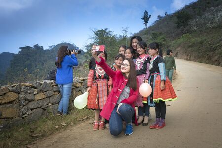 Ha Giang Province, Vietnam - January 20, 2018: H'Mong ethnic minority children in the most beautiful clothes playing together to welcome H'Mong Lunar New Yearのeditorial素材