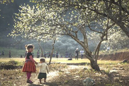 Ha Giang Province, Vietnam - January 20, 2018: H'Mong ethnic minority children in the most beautiful clothes happy to welcome Lunar New Year, H'Mong traditional Lunar Yearのeditorial素材