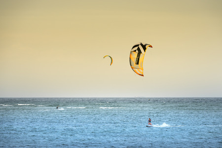 Ninh Chu beach, Ninh Thuan province, Vietnam - 27th January 2018: Tourists Kitesurfing on the waves of the sea the beach on a sunny day at Ninh Chu beach in Vietnamのeditorial素材
