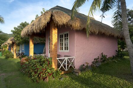 Ninh Van Commune, Khanh Hoa, Vietnam - June 26, 2018: The colorful bungalows with decorative walls in form of Vietnamese rural style in Backpacker Hostel in Ninh Van commune, Khanh Hoa province, VNのeditorial素材