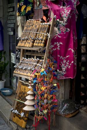 Hanoi capital, Vietnam - July 16, 2018: a souvenir shop which sells bamboo smoking pipes as things for tourists in Hanoi Old Quarter, Vietnam. Traditional pipe tobacco in Vietnam made from bamboo.のeditorial素材