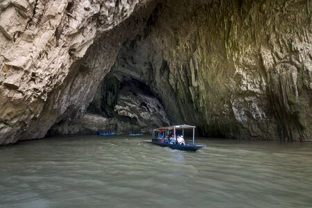 Ba Be lake, Bac Kan Province, Vietnam - July 15, 2018: The beautiful natural scenery of Phong cave with boat tour at Ba Be Lake Nation Park is a famous travel destination in Bac Kan province, Vietnamのeditorial素材
