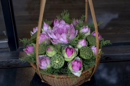 Pink Lotus flower is decorated on the bamboo basketの写真素材