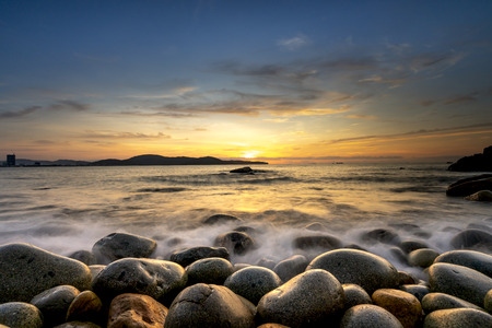Egg stone beach in Quy Nhon, Vietnam. Long time exposure of sea and stones, beautiful sunrise in Quy Nhon city, Vietnamの写真素材