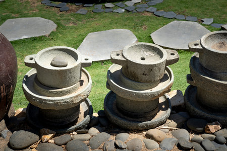 Phu Yen Province, Vietnam - July 21, 2019: Collection of stone powder handy mills on display at Sea...