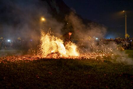 Lam Binh Tuyen Commune, Tuyen Quang province, Vietnam - September 14, 2019:  The traditional fire dance festival of the Pa Then ethnic people to thank the gods for blessing a good crop year, a prosperのeditorial素材