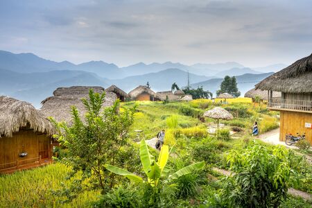 Hoang Su Phi Lodge Resort, Ha Giang Province, Vietnam - September 26, 2019: Wooden bungalows overlooking breathtaking views of mountains and terraces where guests can relax and mingle with nature courのeditorial素材