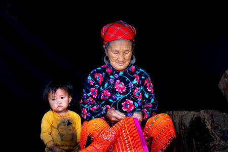 Moc Chau, Son La Province, Vietnam - July 13, 2020: A beautiful portrait of grandma and grandson of ethnic minoritie in Moc Chau district, Son La province, Vietnamのeditorial素材