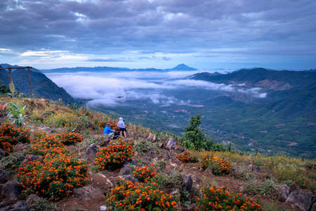 Hang Kia-Pa Co in Mai Chau district, Son La province, Vietnam - July 14, 2020: Tourists at Hang Kia-Pa Co. Hang Kia - Pa Co valley is surrounded by four rocky mountains, covered with clouds all yearのeditorial素材