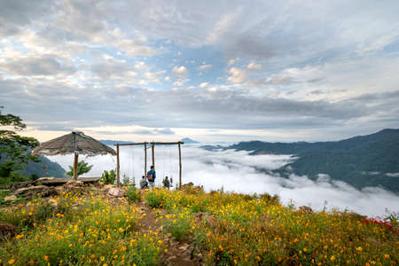 Hang Kia-Pa Co in Mai Chau district, Son La province, Vietnam - July 14, 2020: Tourists at Hang Kia-Pa Co. Hang Kia - Pa Co valley is surrounded by four rocky mountains, covered with clouds all yearのeditorial素材