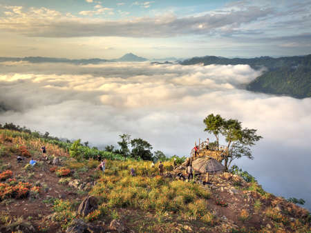 Hang Kia-Pa Co in Mai Chau district, Son La province, Vietnam - July 14, 2020: Tourists at Hang Kia-Pa Co. Hang Kia - Pa Co valley is surrounded by four rocky mountains, covered with clouds all yearのeditorial素材