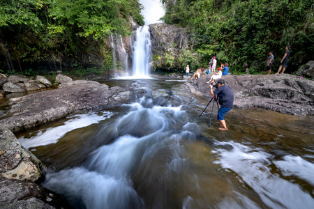 Binh Lieu District, Quang Ninh Province, Vietnam - July 3, 2020: Tourists visit the waterfall in a tropical forest of Binh Lieu District, Quang Ninh Province, Vietnamのeditorial素材