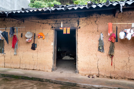 Quang Ninh province, Viet Nam - July 4, 2020: Picture of the house of Dao Thanh Y ethnic minorities in Quang Ninh province, Vietnam (Houses made from wood and bamboo, walls made of clay)のeditorial素材