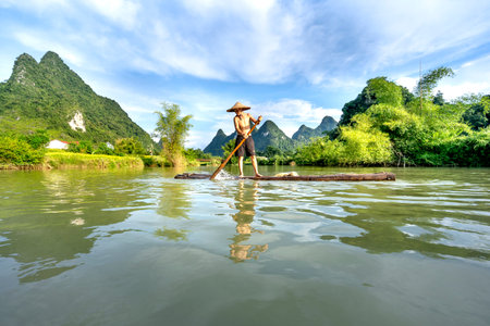 Quay Son River in Phong Nam District, Cao Bang Province, Vietnam - September 13, 2020: Fishermen fishing on Quay Son River in Phong Nam District, Cao Bang Province, Vietnamのeditorial素材