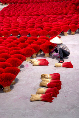 Traditional incense making village Ung Hoa, Hanoi, Vietnam - May 26, 2020: Traditional village workers of Ung Hoa incense are doing the incense drying process. This is a famous craft incense making VNのeditorial素材