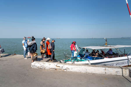 Lan Ha Bay, Quang Ninh province, Vietnam - November 12, 2020: The staff of the 5-star Heritage Cruise company welcomes you to the canoe to transfer to the Heritage Cruise offshoreのeditorial素材