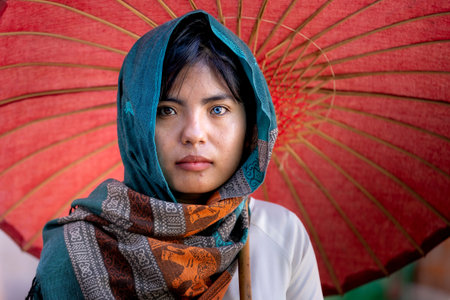 Ninh Thuan Province, Vietnam - January 16, 2021: An image of a Cham ethnic girl with two colored...