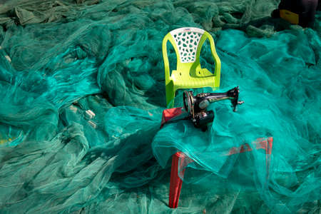 Vinh Hy Bay, Ninh Thuan Province, Vietnam - January 17, 2021: Vietnamese woman working as a net mending worker in Vinh Hy Bay, Ninh Thuan Province, Vietnamのeditorial素材