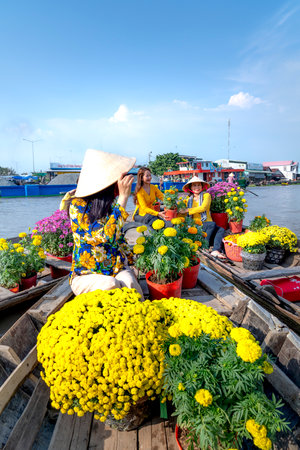 The cross-five-branches of river floating market in Soc Trang province, Viet Nam - February 6, 2021: Tourists explore the cross-five-branches of river floating market during the Lunar New Year 2021のeditorial素材