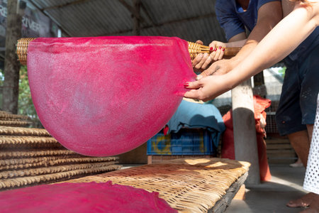 Noodle making village in An Binh Ward, Ninh Kieu District, Can Tho City, Viet Nam-February 7, 2021: Images of the stages of rice cake coating and sun drying to make famous noodles in Can Tho City, VNのeditorial素材
