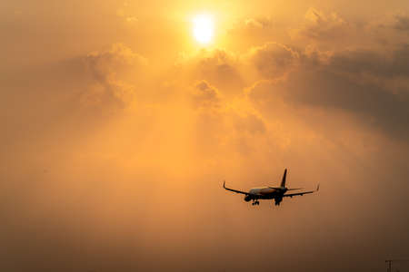 Tan Son Nhat Airport, Ho Chi Minh City, Vietnam - February 28, 2021: Commercial aircraft in the sunsetのeditorial素材