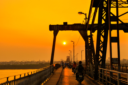 Hanoi, Vietnam - 18 November,2012: People go home in the sunset at Long Bien bridgeのeditorial素材