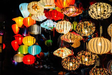 Hoi An, Vietnam - July 15, 2012: Lanterns are lighted up at the front of the small shopのeditorial素材