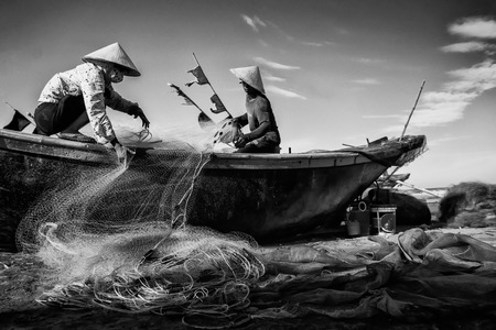 Hai Ly, Hai Hau, Vietnam - June 27, 2015: People are preparing for the fishing day at the beachのeditorial素材