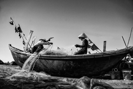 Hai Ly, Hai Hau, Vietnam - June 27, 2015: People are preparing for the fishing day at the beachのeditorial素材