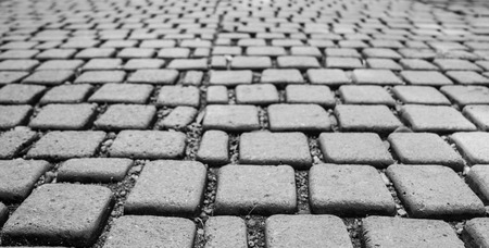 Cobblestone on footpath in black and white tone, selective focus.の写真素材