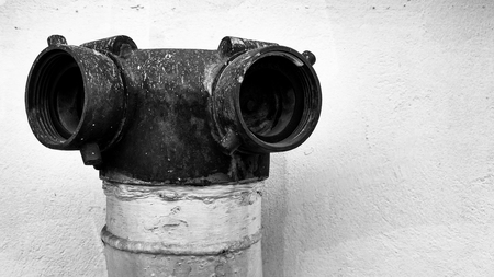 Old vintage fire department connection and rust stains in black and white tone, selective focus.の写真素材