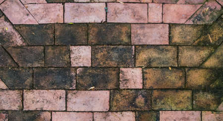 A top view of pavement brick with water stain background.の写真素材