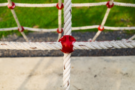 Detail of safety net in playground area, selective focus.