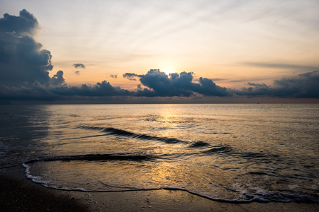 Sunrise sky and beach wave background.の写真素材