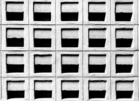 Ventilation cement block wall pattern in the under tone with black and white color, selective focus.の写真素材