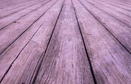 Closeup view of exterior pine wood floor with natural texture in perspective view, selective focusの写真素材