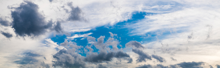 Panorama view of white cloudy and blue sky background.の写真素材