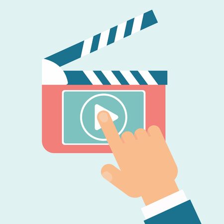 Hand presses play video button on clapperboard.のイラスト素材