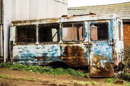 metallic house style grunge, old bus at the dumpの写真素材