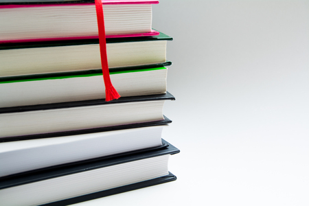 books with bookmark at the white isolated backgroundの写真素材