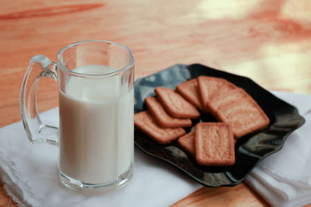 Delicious breakfast with milk and coconut biscuitの写真素材