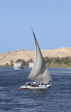 Fellucas on the River Nile near to Aswan in Egypt. Fellucas are the traditional sailing craft of the Nileの写真素材