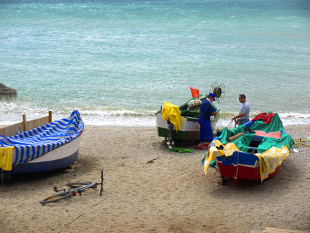 Fishermen on the beach in Nerja on the Costa del Sol in Andalucia Spainのeditorial素材