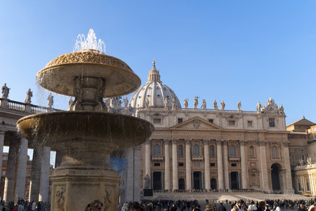 Fountain in St Peters Square by St Peters Basilica in Rome Italyのeditorial素材