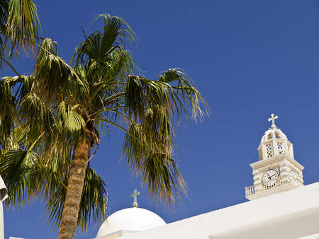 The tower of the Catholic Cathedral in Fira Capital of the Island of Santorini Greeceの写真素材